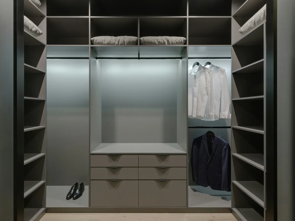  Walk-in closet well lit with dressing room.